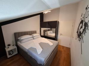 Postel nebo postele na pokoji v ubytování Apartment Tin