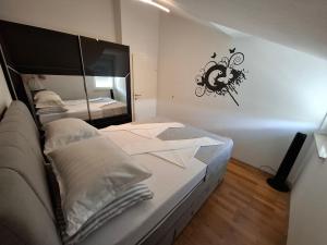 Postel nebo postele na pokoji v ubytování Apartment Tin
