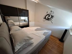 Postel nebo postele na pokoji v ubytování Apartment Tin