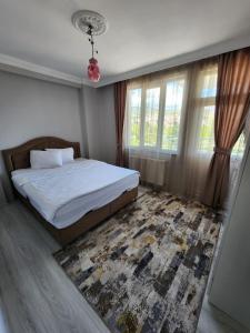 A bed or beds in a room at VATAN SUİT