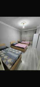A bed or beds in a room at VATAN SUİT