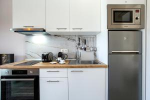 Kuchyň nebo kuchyňský kout v ubytování Ethra Apartment