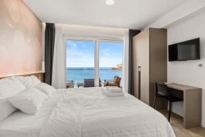 Voodi või voodid majutusasutuse Calypso Residence toas