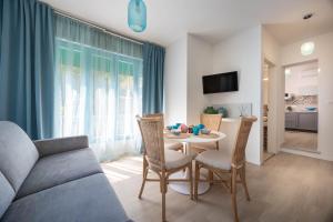TV a/nebo společenská místnost v ubytování Hotel Altea