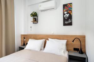 Postel nebo postele na pokoji v ubytování Ethra Apartment