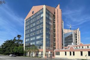 a large brick building with a cross on top of it at Blu Milano Relax Apartment in Milan