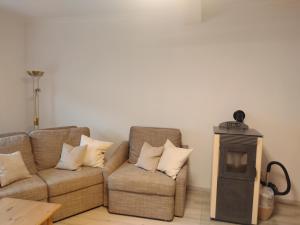 a living room with a couch and a stove at Schwandorf22 in Bretten