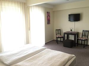 Postel nebo postele na pokoji v ubytování Hotel Gasthof am Waldeck