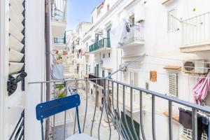 a balcony in a city with white buildings at APARTAMENT ANNA - Julia Vieste in Vieste