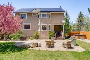 a home with a patio with chairs in the yard at Private Hot Tub Spacious Family Home in Truckee! in Truckee