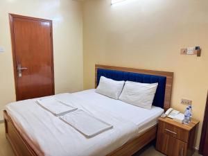 Postel nebo postele na pokoji v ubytování Al Khaima Hotel
