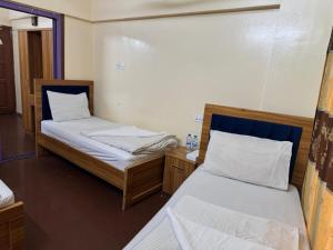 Postel nebo postele na pokoji v ubytování Al Khaima Hotel