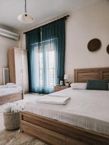 Postel nebo postele na pokoji v ubytování Aktaion Hotel