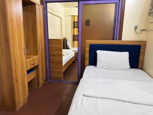 Postel nebo postele na pokoji v ubytování Al Khaima Hotel