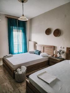 Postel nebo postele na pokoji v ubytování Aktaion Hotel