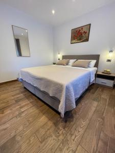 Postel nebo postele na pokoji v ubytování Apartments Anna I