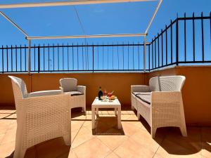 two chairs and a table on a balcony at Morosini 43 in Terracina