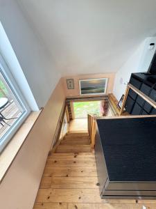 a staircase in a tiny house at Getaway from the city in Paspėriai