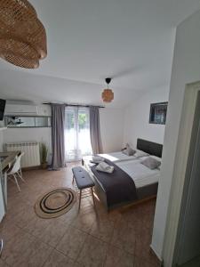 Postel nebo postele na pokoji v ubytování Martina Guest house