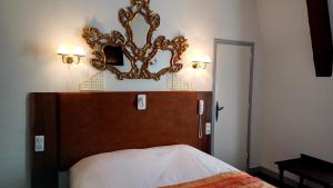Postel nebo postele na pokoji v ubytování Hotel Montsegur