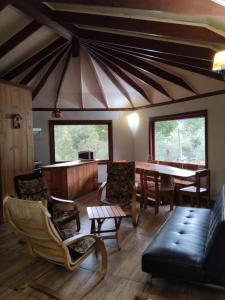 a living room with a couch and a table at Antucalhue Mountain Resort in Antuco
