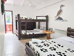 Voodi või voodid majutusasutuse EcoHotel El Castillo Pance toas