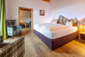 Łóżko lub łóżka w pokoju w obiekcie Hotel Seelos