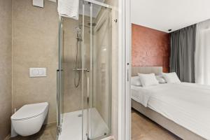 Koupelna v ubytování Calypso Residence + 37 fotografií