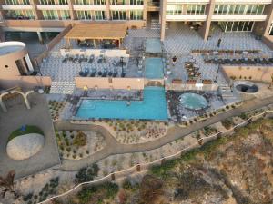 an aerial view of a resort with a swimming pool at Departamento Costa Playas de Tijuana in Tijuana