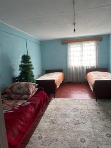 Postel nebo postele na pokoji v ubytování Guest House Noe