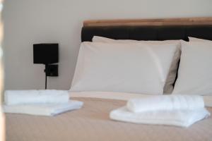 Giường trong phòng chung tại Must in +5 ảnh