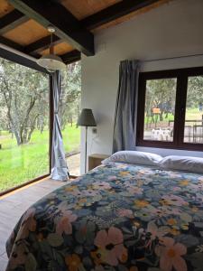 Postel nebo postele na pokoji v ubytování Nuevo Ecolodge Cabañeros