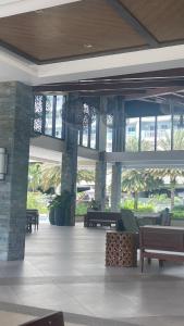 a lobby of a building with benches and windows at Condominium Luxury 1 bedroom, impressive amenities in Davao City +17 photos