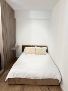 Ένα ή περισσότερα κρεβάτια σε δωμάτιο στο Oasis One