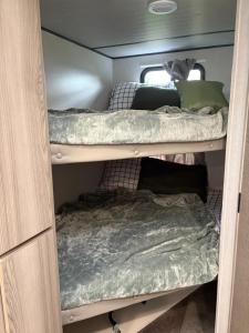 a room with two bunk beds in it at TN River Retreat in Lobelville
