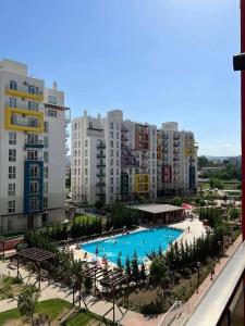 a view of a large swimming pool in a city at green diamond 3 bedroom in Tbilisi City