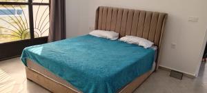 Katil atau katil-katil dalam bilik di Villa for families