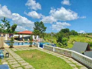 a villa with a swimming pool in a resort at Infinity pines tagaytay in Sampong