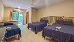 Postel nebo postele na pokoji v ubytování Casa Daniels Guesthouse + 37 fotografií