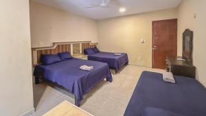 Postel nebo postele na pokoji v ubytování Casa Daniels Guesthouse
