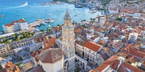 an aerial view of a city with a clock tower at Luxury Rooms Floramye in Split