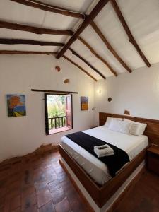 Postel nebo postele na pokoji v ubytování Eco-Lodge Barichara