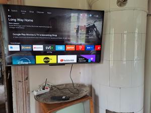 a flat screen tv sitting on top of a table at Rosendala long stay by House Viola, 3 bedroom entire house in Bodafors, sleeps 7 in Bodafors
