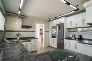 A kitchen or kitchenette at Villa Views Can Funtasa II