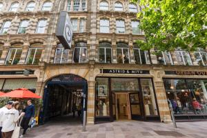 a large building with people standing outside of it at In the middle of Cardiff City centre in Cardiff