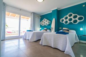 A bed or beds in a room at Villa Views Can Funtasa II
