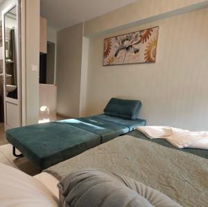 Postel nebo postele na pokoji v ubytování Nava Apartments
