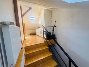 a staircase in a house with wooden floors at Work'n'Sleep Mulhouse in Mulhouse