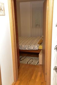 Postel nebo postele na pokoji v ubytování Apartman U2