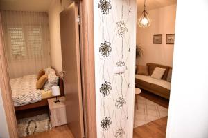 Postel nebo postele na pokoji v ubytování Apartman U2